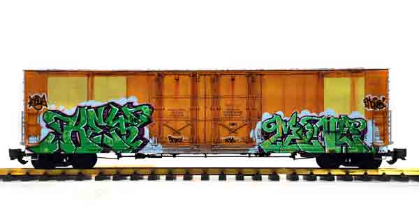 orange boxcar with graffiti