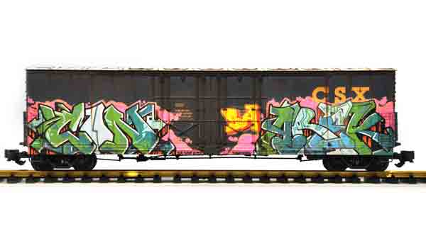 black boxcar with graffiti