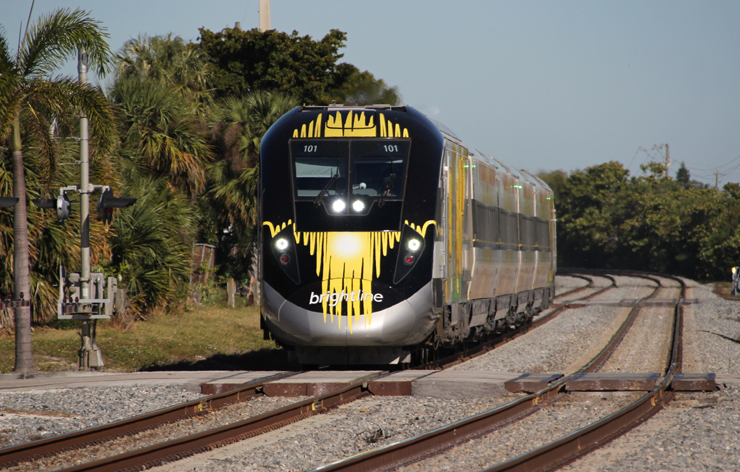 black and yellow high-speed train. Brightline Orlando to launch service Sept. 22.