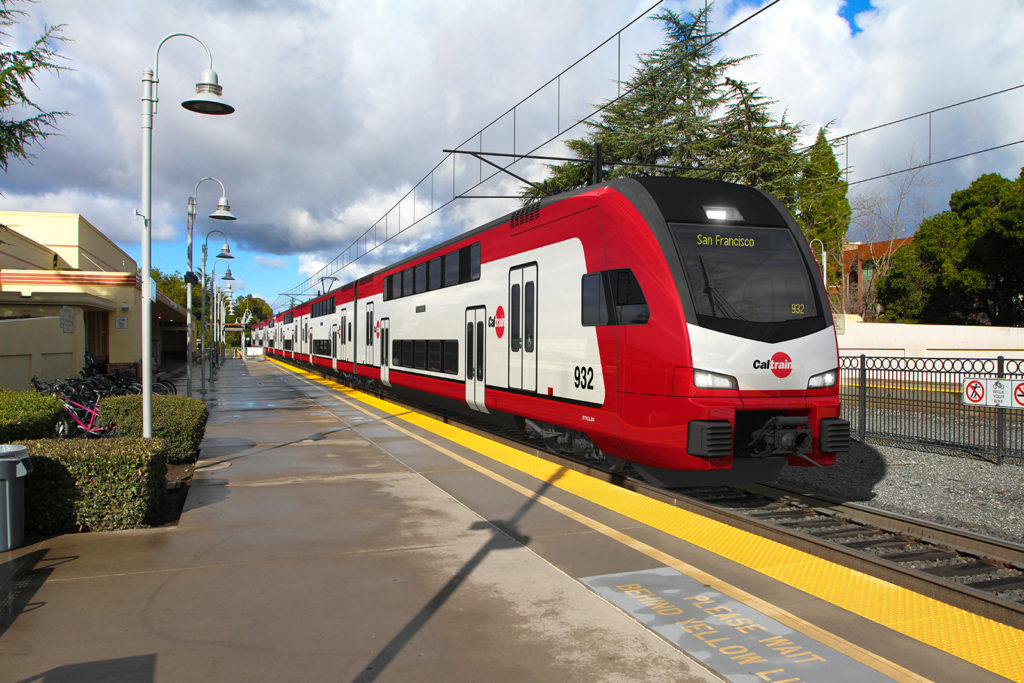 Red and white Caltrain at station.