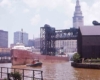 Lake boat passing under raised railroad bridge