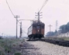 Orange electric interurban rail car