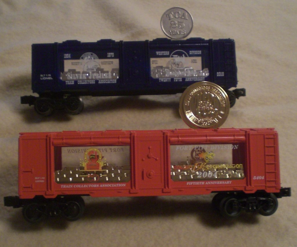 two boxcars, one red and one black