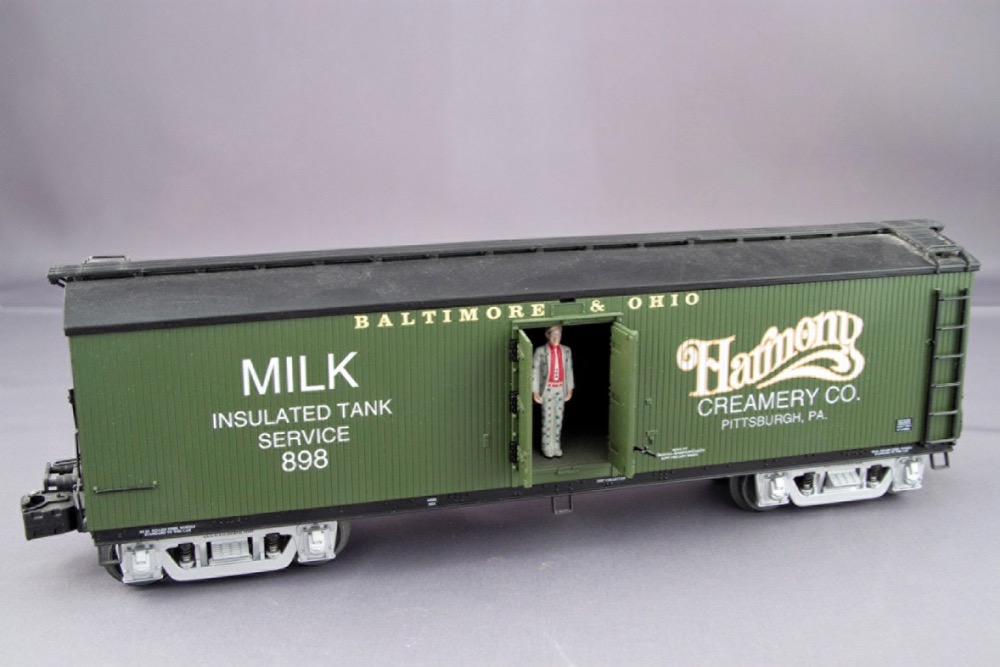 A green painted milk car lettered for the Baltimore & Ohio.