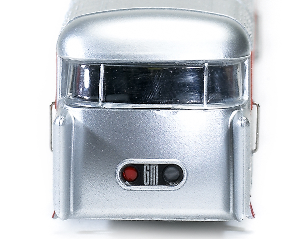 The tail car has directional taillights. The red light is illuminated when the train is moving forward.