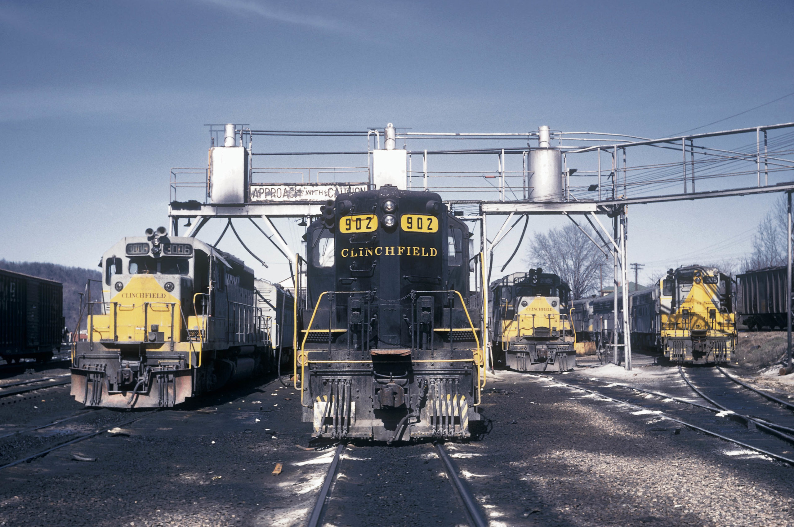 First- and second-generation diesel locomotives congregate at Erwin in March 1972. Legend has it that Clinchfield Railroad told EMD to “just follow our F-unit paint styling” on hood units.