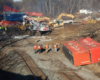 Workers cleaning up a train derailment 