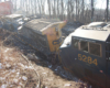 A close up picture of a derailed train