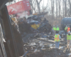 Workers cleaning up a derailed train