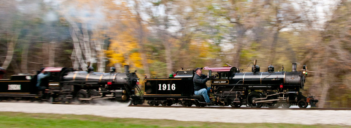 Two steam locomotives on small-gauge railroad