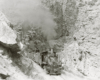 A black and white photo of the Denver &g Rio Grande Western 2-8-0 narrow-gauge steam locomotive No. 361 coming through the rocks