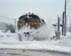 A train plowing through snow