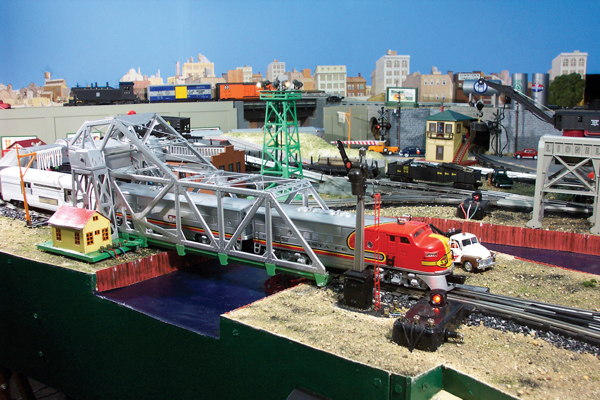 toy train crossing bridge on layout