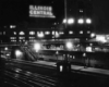 a passenger train parked at a station at night