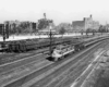 three trains with New Orleans in the background