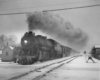 a steam passerger train on a winter day