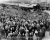 A black and white giant group photo taken in front of a train