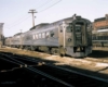 Two trains sitting outside a station