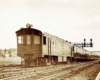 A train passing beneath a stop light