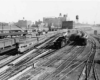 freight and passenger trains in a train yard