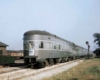 a passenger train in front of a station