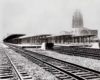 train platforms with a train station in the background