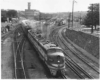 Diesel powered passenger train departs large station