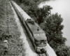 Diesel locomotive with passenger train along river