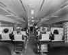 Passengers sit inside coach