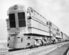 a steam turbine locomotive pulling passenger cars