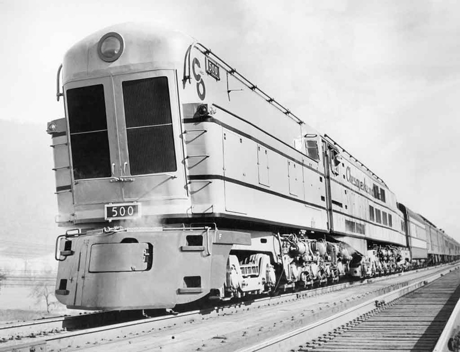 a steam turbine locomotive pulling passenger cars