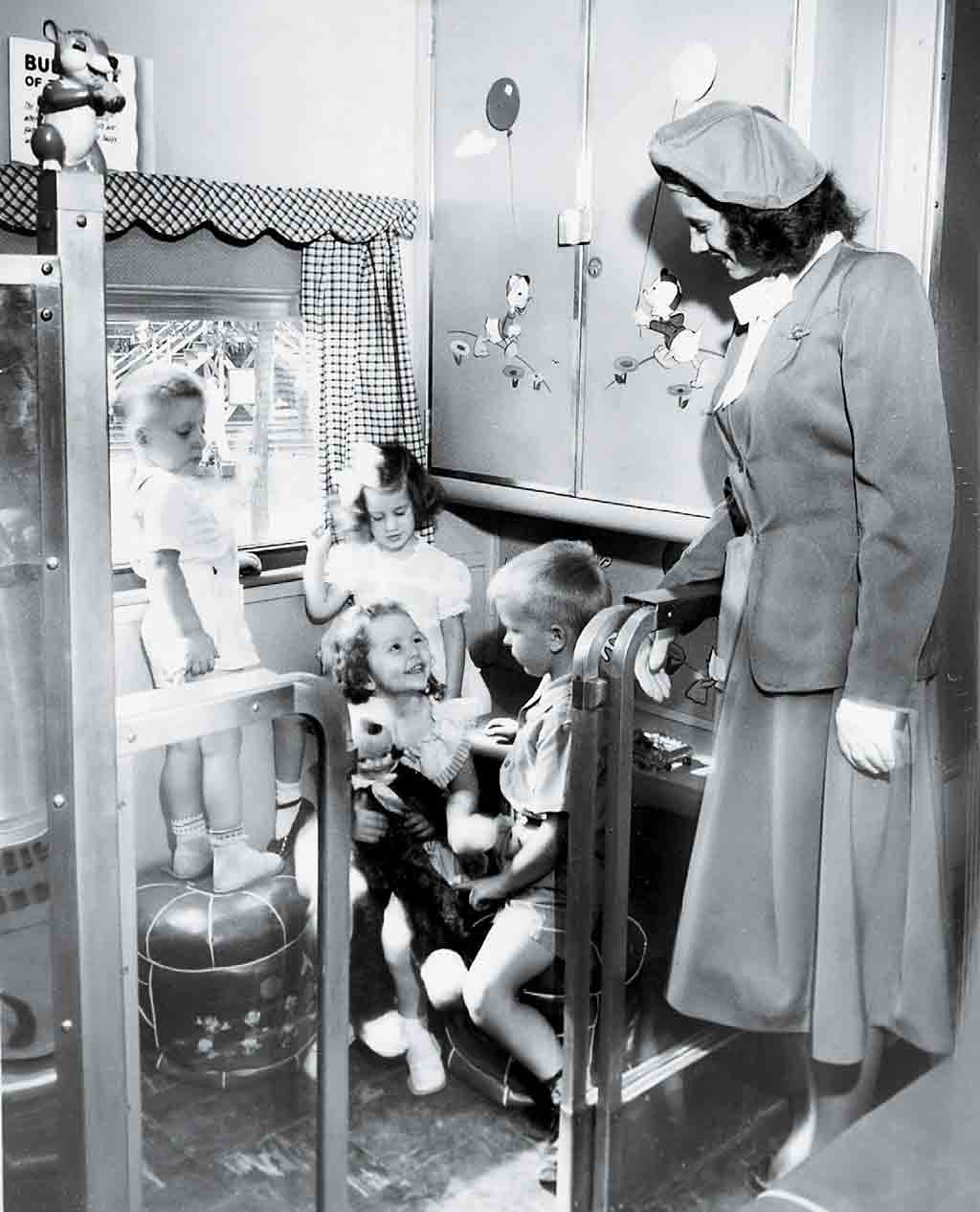 children playing with toys by a hostess