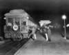 a couple getting onto a passenger car observation car