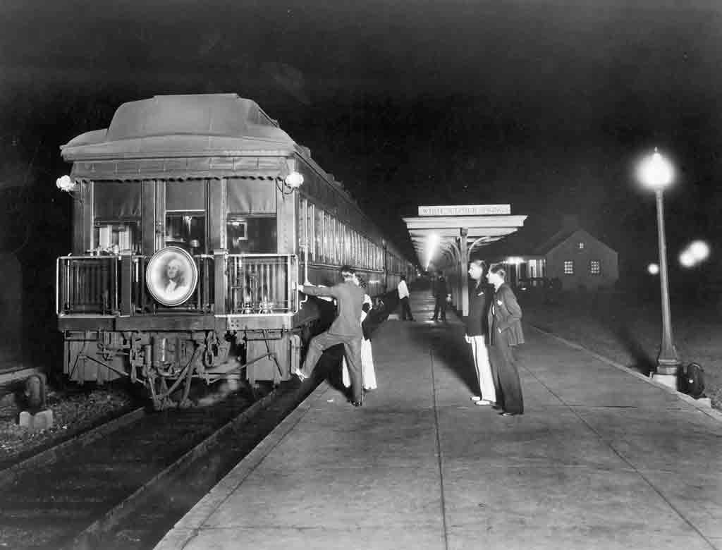 a couple getting onto a passenger car observation car