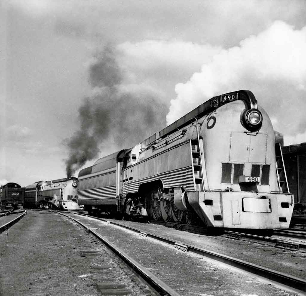 a streamlined steam locomotive pulling passenger cars