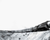 A black and white photo of a locomotive turning a corner 