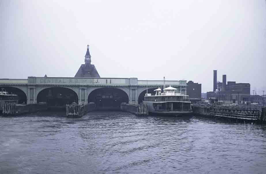 A distant shot of a ferry sitting at the terminal