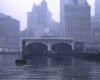 A distant picture of a ferry terminal with the city in the background