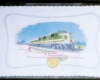 A white placemat with a green and yellow train on it