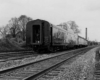 A black and white picture of the back of a train