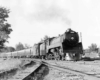 Steam locomotive on passenger train in curve