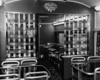 A black and white photo of the inside of an empty dining passenger car 