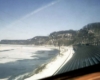 A photo taken from the top of a train as it travels through a snowy area