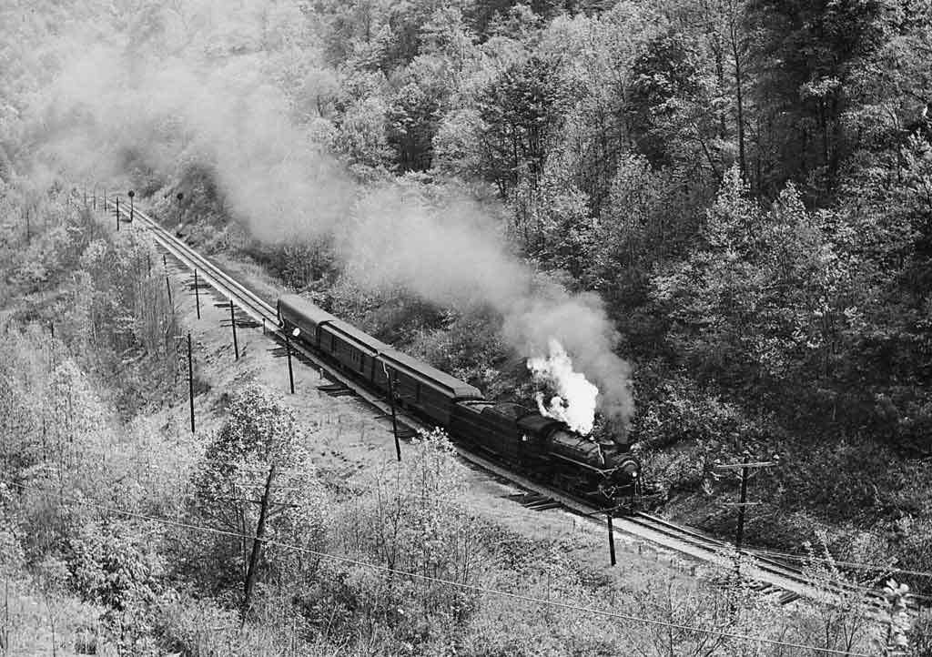an aerial view of a steam passenger train