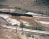 An overhead distance shot of a locomotive on the tracks