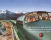 A postcard that shows passengers sitting inside a green train as it passes through the mountains