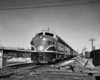 Diesel locomotives with passenger train approaching diamond crossing