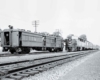 A black and white photo of two trains passing each other