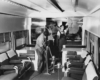 people cleaning the interior of a couch lounge car