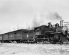 A steam engine pulling passenger cars